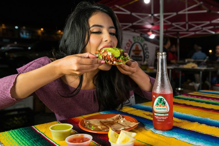 A woman eating at Paco's Tacos and Tequila, a Tex Mex bar in SouthPark Charlotte