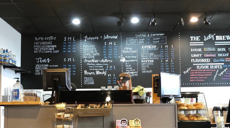 Interior counter and menu at Rocky River Coffee in Harrisburg, NC