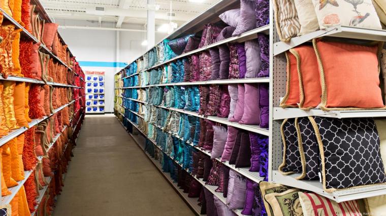 Aisle with colorful pillows at At Home home goods store