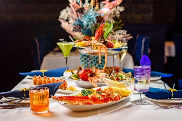 Elaborate seafood tower with cocktails at Sea Grill in Charlotte, NC