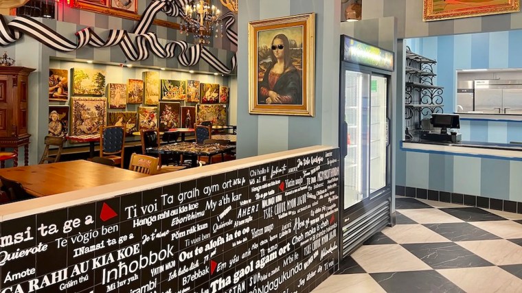 Interior of Amelie's French Bakery in Uptown with counter and colorful background