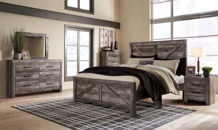 Weathered light grey bedroom furniture with rug from Galleria Furniture in Charlotte, NC
